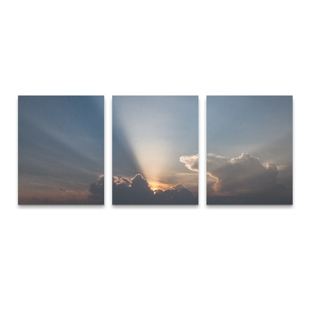 Tris - Raggi di sole tra le nubi al tramonto